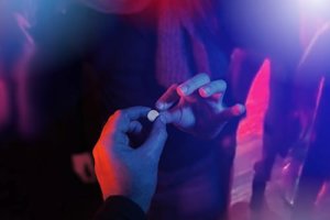 People in a club swapping drugs might make you wonder is MDMA addictive